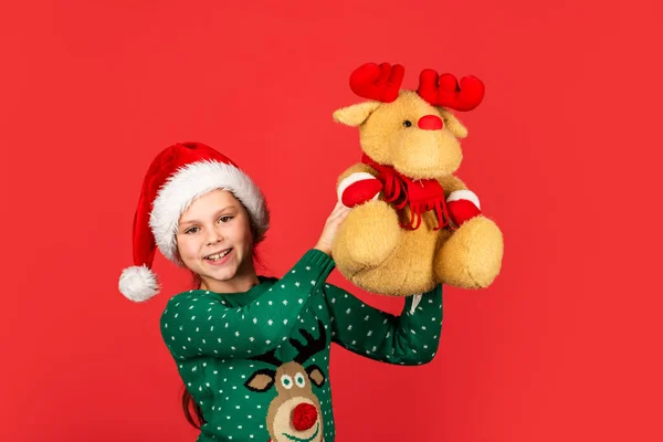 Being surprised. winter holiday mood. surprise for new year holiday. everyone will get a present. small girl santa with toy. kid with purchase. christmas shopping and sale. xmas party surprise — Stock Photo, Image