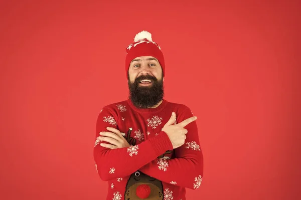 Christmas Sweater Party. Winter outfit. Good vibes. Fashion shop. Winter bucket list. Hipster bearded man wear winter sweater and hat red background. Happy new year concept. Join holiday party — Stock Photo, Image