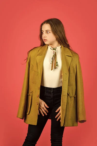 Oversize concept. Trench coat fashion trend. Fashionable coat. Little girl posing jacket coat with collar. Clothes and accessory. Girl fashion model wear coat for spring and autumn season. Shopping