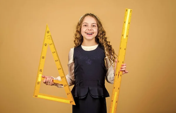 What a long ruler. Surprised little student holding rigid wooden ruler on  yellow background. Small child taking measurements with metric ruler. My  ruler is one meter long Stock Photo by ©stetsik 357046252
