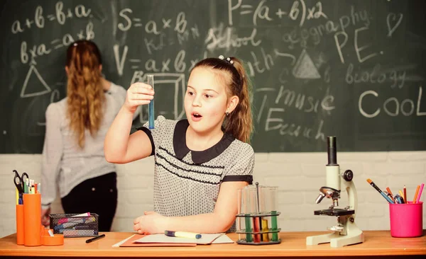 Pupils at chalkboard chemistry lesson. Laboratory practice. Chemistry classes. Fascinating science. Educational experiment. Girls classmates study chemistry. Microscope test tubes chemical reactions — Stock Photo, Image