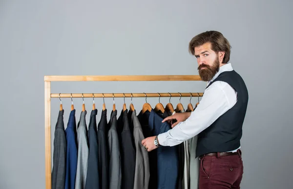 His look is great. Fashion design studio. Male fashion designer. Individual measures hand of man. Man ordering business suit posing indoor. Tailor measures man. stylish business man at workspace — Stock Photo, Image