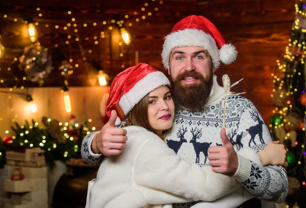 Equipment outdoor sport. Active winter. Winter sports. Happy couple with figure skates. Happy together. Christmas gift. Winter holidays. Family leisure. Bearded man and Santa girl. Weekend concept