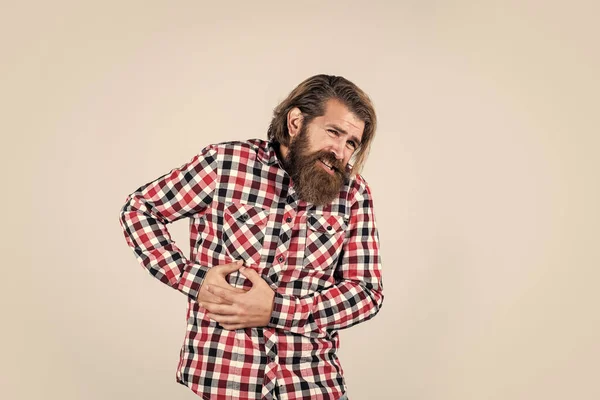 Looking very bad. bearded man wear checkered shirt. brutal man feeling pain. male health care. pain in heart. mature hipster with beard has heartache. brutal caucasian guy with moustache — Stock Photo, Image