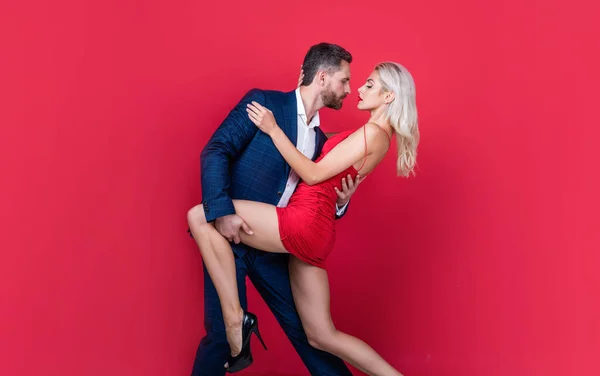 Temptation. sensual couple in love. love and romantic relationship. girlfriend and boyfriend on date. formal couple feel passion. express the desire. fashion. man embrace sexy woman — Stock Photo, Image