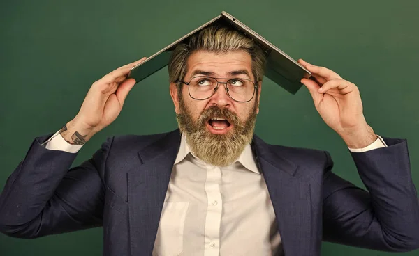 Lot of information. Online madness. Provide accurate current information. Teacher hold laptop surfing internet. Bearded man laptop on head. Interesting information. School lifehack. Homeschooling