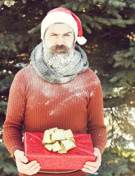 Handsome santa man with gift — Stock Photo, Image