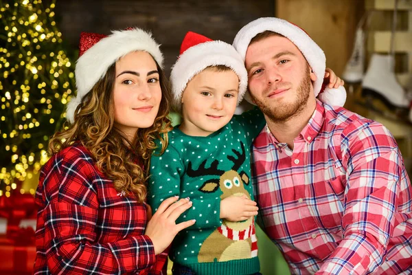 Happy holidays. Christmas tradition. Father and mother with cute son christmas tree background. Idyllic moment. Family values. Boxing day. Spend time with family. Parents and child christmas eve