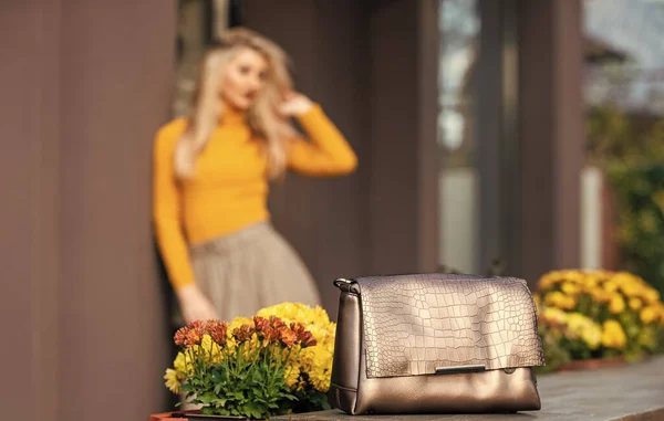 Really useful accessory. Bronze handbag clutch for woman. Luxury leather purse. Shopping sale and discount. Fashion purse. Pretty woman defocused and her beautiful purse close up. Womanhood concept — Stock Photo, Image