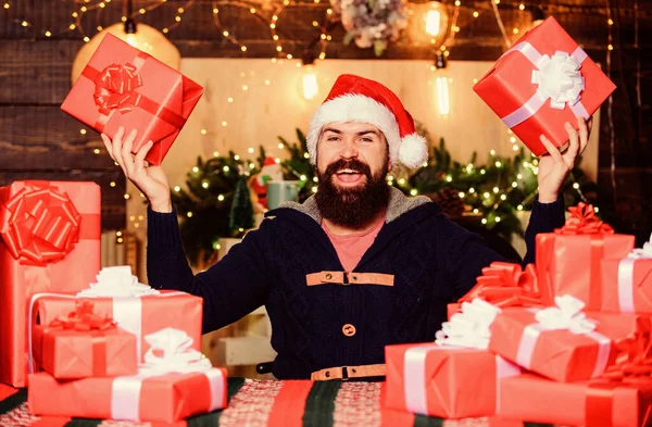 Holiday atmosphere. happy new year. Xmas present box. christmas presents delivery. Boxing day. happy bearded man. winter shopping sales. holiday celebration. hipster santa hat. Christmas shopping