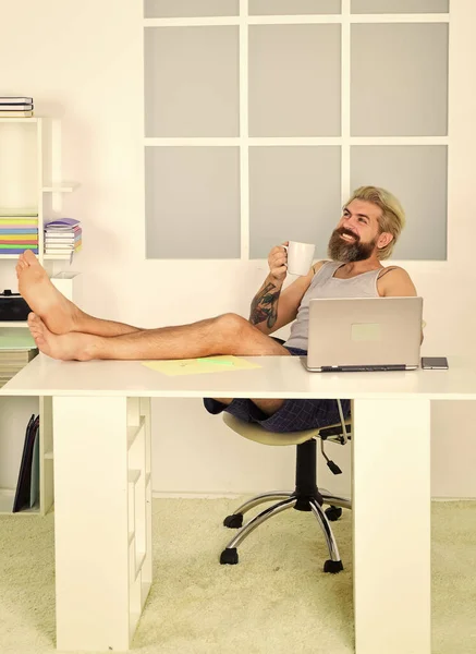 Always wanted to work from home. Lockdown self isolation and quarantine. Barefoot guy working from home. Man work laptop. Comfortable workplace. Social networks. Social distancing. Too lazy to work — Stock Photo, Image