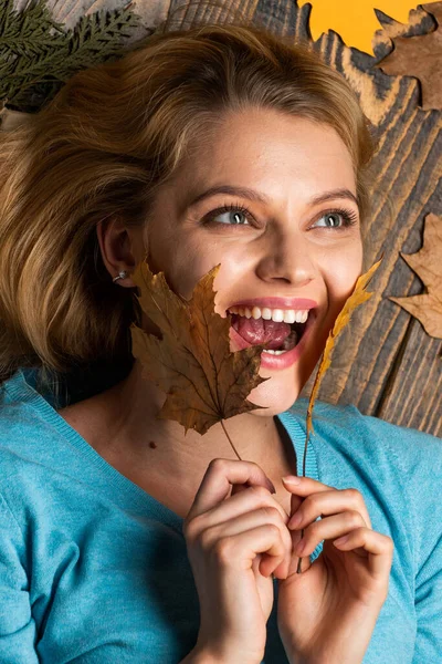Time to rest. Beauty in autumn style. Sharing love to nature. Staying beautiful any season. autumn female fashion. Carefree and happy. woman hold maple leaf. canada. girl relax on autumn background — Stock Photo, Image