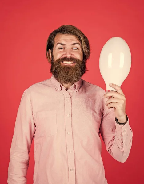 Smiling man hold big lamp. got new idea. concept of creativity. man just inspired. economy of electricity. bright minded hipster. creative inspiration. light your way. bearded man with bulb — Stock Photo, Image