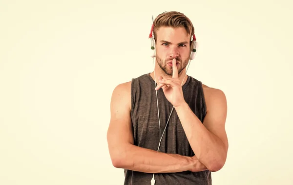 Man handsome unshaven hipster listening music using headphones gadget. Listen music for motivation and inspiration. Audio quality. Modern earphones. Online music services. Inspiring music concept