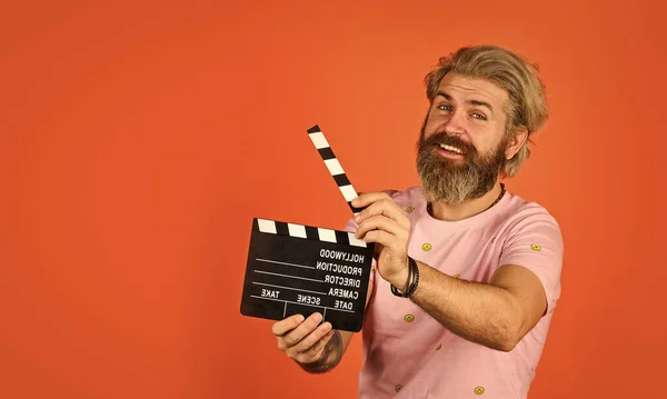 Film director concept. catch the feeling. Professional Actor Ready for Shoot. ready to film new scene. man with movie clapper. bearded guy with film making clapperboard. movie time. copy space