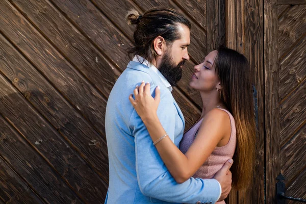 First meet. bearded man hipster hug sexy woman. guy embrace his girl outdoor. couple in love. feel the romance. first meet date. celebrate romantic holiday. family anniversary. pure feelings