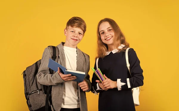 Legal knowledge, human wisdom. Happy children on Knowledge day. Little kids hold books. September 1. School knowledge. Education and study. Developing pupils knowledge skills