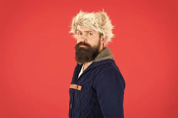 Ready to beat winter cold. fur hat accessory. bearded man ready for winter activity. get warm and comfortable. male fashion. serious trendy hipster. beard care in cold season. brutal man earflap hat — Stock Photo, Image