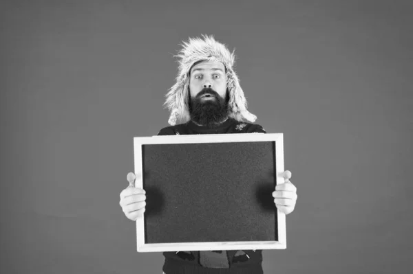 Promotion. Winter event. Winter holiday. Schedule timing concept. Seasonal offer. Presentation concept. Winter announcement. Bearded man blank blackboard copy space. Chalkboard for information — Stock Photo, Image