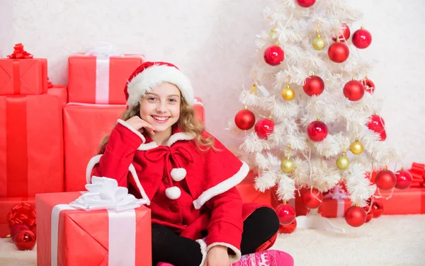 Winter holiday tradition. Christmas spirit is here. Kid happy with christmas present. Girl celebrate christmas open gift box. Unpacking christmas gift. Santa bring her gift. Winter shopping sales — Stock Photo, Image