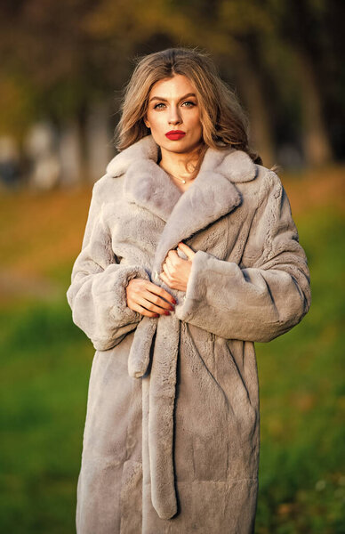 Sexy woman red lips wear fur coat. Businesswoman in fur coat. Simple and warm. Glamorous lady. Cosy autumn outfit. Winter fashion trends. Luxury segment brand. Fur boutique. Soft jacket furry texture