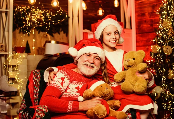 Happy childhood. Family home. Family time. Family tradition concept. Boxing day. Visiting grandparents. Child enjoy christmas with Santa claus. Granddaughter spend time with grandpa. Christmas eve — Stock Photo, Image