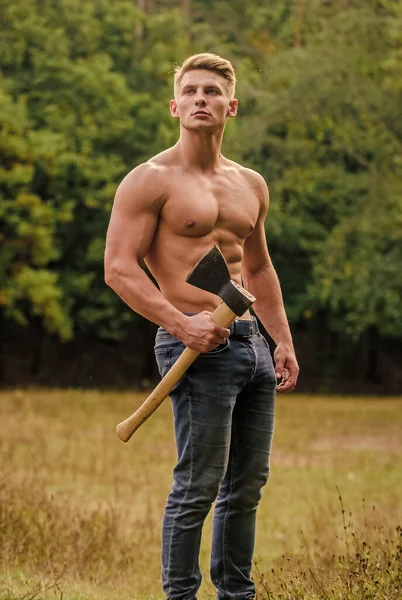 Hooligan man. sexy macho bare torso ax. brutal and attractive male in wood. bodybuilder show his muscles. power and strength. lumberjack carry axe. man strong body. muscular man with axe — Stock Photo, Image