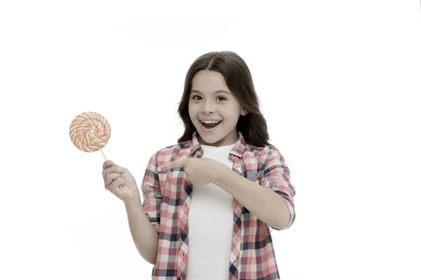 Impressing fact sugar nutrition. Girl child smiling holds lollipop candy. Girl kid with lollipop looks surprised. Healthy nutrition and dieting concept. Surprising effect sugar. Holiday sweet treats — Stock Photo, Image