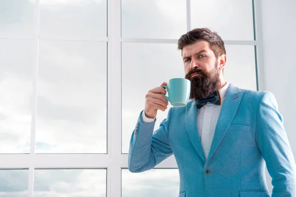 future opportunities. serious bearded man drink coffee. businessman in formal outfit. modern life. confident business man at window. future success. morning inspiration. copy space. Future is now