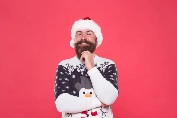 So pleased. happy new year. merry christmas. cheerful bearded man in santa hat and sweater. brutal hipster celebrate xmas party. winter holiday preparations. male winter knitwear fashion — Stock Photo, Image