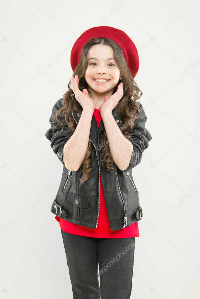 Discover the beauty within. Happy beauty girl smiling on yellow background. Beauty look of adorable small girl. Little child with charming smile on beauty face and brunette long hair