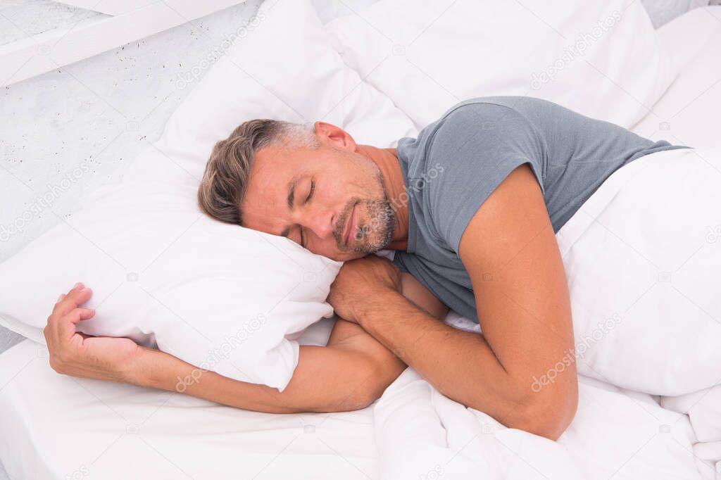 Man laying on bed awake. sleeping in comfortable bed. good morning. Just relaxing. Slumber man. Bearded man sleep on bed in bedroom. male in bed. Good nap. Man closed eyes while relaxation