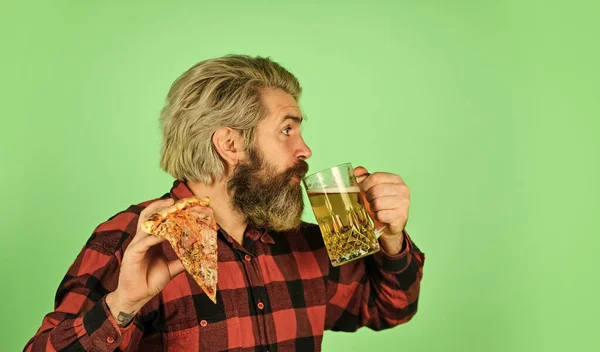 Perfect rest in pub. Finally pizza time. Pizza is better when shared. Pizzeria restaurant. Gourmet food. Cheerful man bearded hipster hold pizza. Hungry man going to eat pizza and drink beer