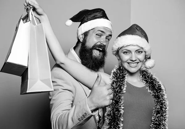 preparation success. happy family couple xmas. santa man and woman with tinsel. christmas shopping sales. winter holidays celebrate together. happy new year party. gift with love. time for presents