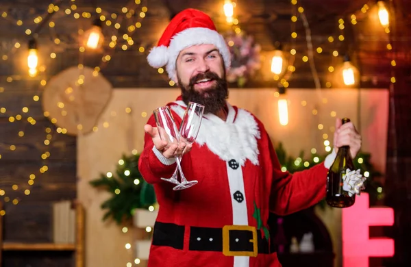 Man bearded santa celebrate christmas with alcohol drink. Celebrate with joy. New year celebration. Sparkling wine. Santa claus drinking champagne. Celebrate winter holidays. Indulge yourself in joy