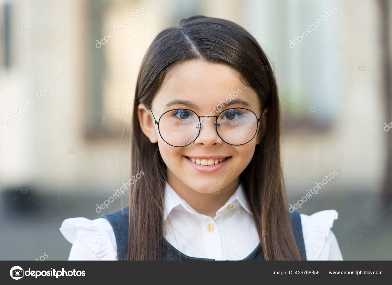 Smart at first sight. Happy kid wear eyeglasses outdoors. Sight test. Eye examination. Pediatric ophthalmology. Fashion eyewear. Trendy glasses. Vision correction. Optician salon. School education Sto...