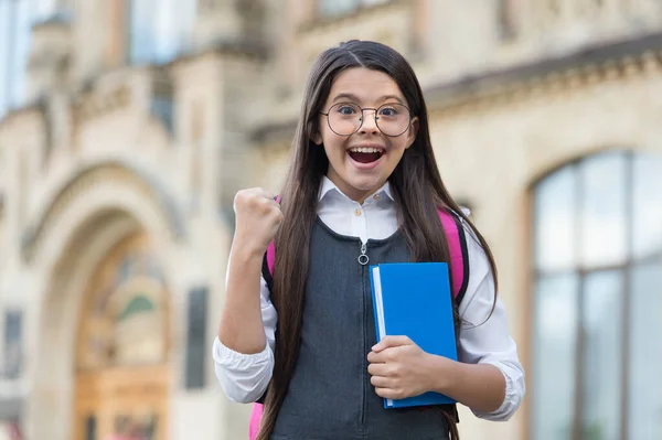 Scholarship winner. Happy child make winning gesture outdoors. Scholarship student. School education. Academic achievement. Study grant and subsidy. Investment in your future — Stock Photo, Image