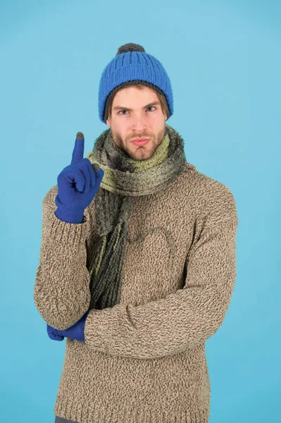 Fresh idea. Man handsome unshaven guy wear winter accessories on blue background. Shopping concept. Emotional expression. Winter season sale. Hipster knitted winter hat scarf and gloves. Finger up — Stock Photo, Image