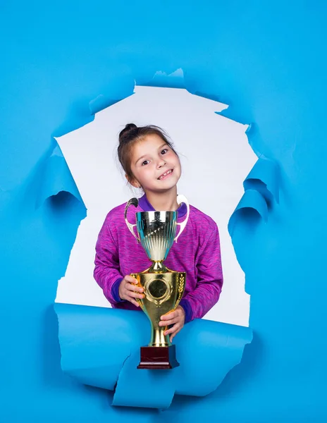 Dedicated to fitness. smiling child with championship cup. childhood happiness. pretty teenage girl in sportswear. kid fitness champion. healthy lifestyle. happy competition winner. best reward ever