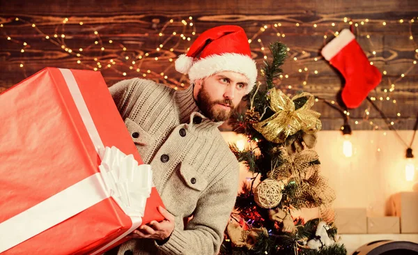 Handsome guy with giant gift box. I am here to give present. Delivering happiness to your home. Delivery service. Spread happiness. Giving happiness. Winter happiness. Happy holidays. Santa Claus — Stock Photo, Image