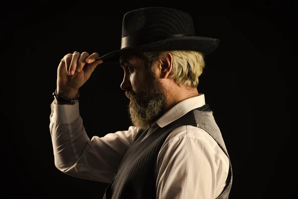 Past centuries trend. Retro gentlemen. Mature handsome man. Man in vintage hat side view. Brutal bearded hipster. Real masculinity. Masculine appearance. Bearded guy black background. Beard grooming