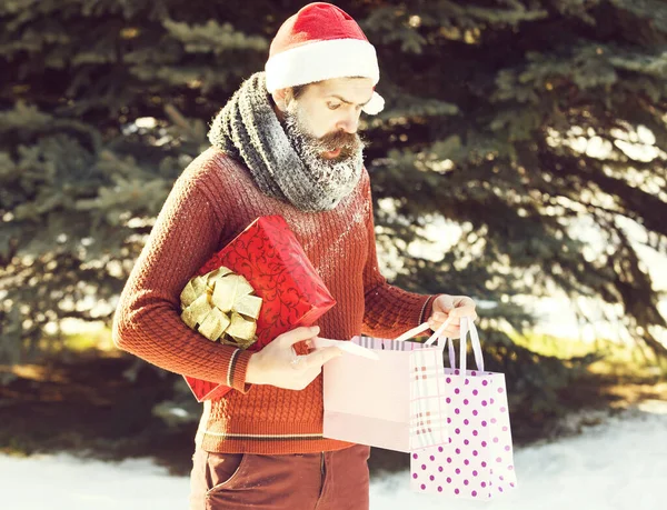 Surprised santa man opens presents — Stock Photo, Image