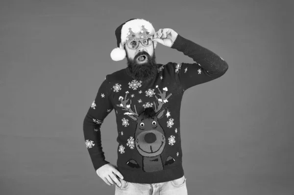 Winter party outfit. Sweater with deer. Hipster bearded man photo booth props red background. Christmas celebration ideas. Winter style. Happy new year celebration. Join holiday celebration — Stock Photo, Image