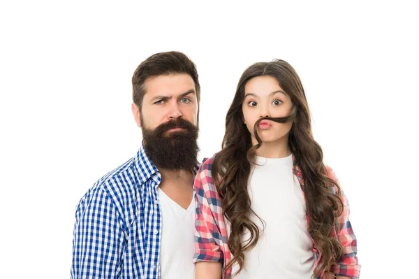 All you need is mustache. Bearded man with beard and natural mustache while little girl making fake mustache with her hair. Father with thick mustache and beard hair and small daughter with long hair — Stock Photo, Image