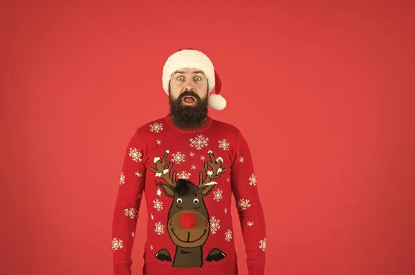 Last preparations. hipster man in red santa hat. happy winter holidays. new year party. christmas is here. man beard red background. surprised man with reindeer on sweater. traditional xmas look — Stock Photo, Image