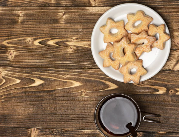 Tea and cookies on wooden background, copy space — Stock Photo, Image