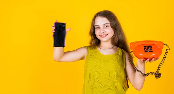 Happy child with retro and modern phone for communication, digital world — Stock Photo, Image