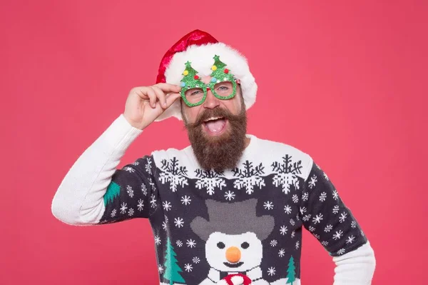 Santa guy in hat and party glasses like his favorite winter sweater having fun on new year holiday, winter holiday — Stock Photo, Image