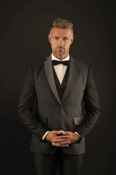 Lets bachelor party begin. Bachelor man dark background. Single man in formalwear. Celebrating bachelor day. Desirable bachelor. Mens formal fashion and style. November 11. Singles day