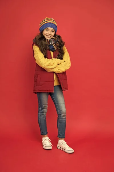Style your look with casual outfit. Small child wear casual style. Little girl in casual clothing red background. Casual wardrobe for fall or winter. Add bold note to everyday look